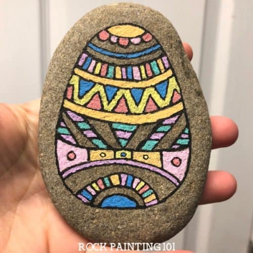 Create beautiful Easter egg painted rocks with this fun rock painting idea. With hints of Mandala art as inspiration, this rock is perfect for the beginner.
