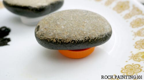 Give your rocks an all around base coat with these rock painting for beginner tips.