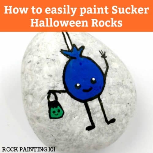 Learn how to paint a lollipop on rocks with this simple tutorial. Grab your paint pens or your favorite paint brush and let's enjoy this fun Halloween rock painting idea. #halloweenrockpainting #rockpaintingideas #lollipop #sucker #trickortreat #halloweenart #cutehalloweenpaintedrocks #stonepainting #halloweenstones #rockpainting101
