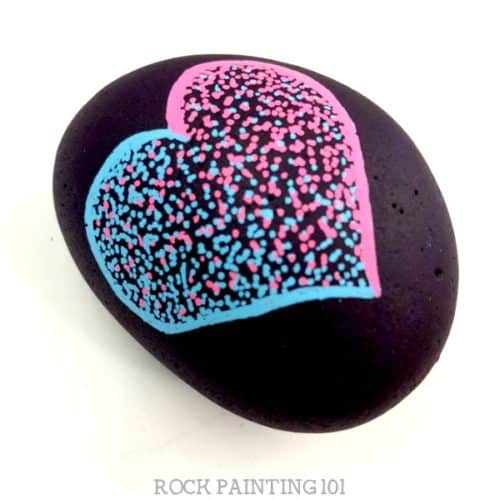 This easy pointillism tutorial is perfect for rock painting beginners. We used this art technique to create a heart rock, but you can paint any shape you want! #pointillism #heart #rockpainting #art #rockart #heartrock #stonepainting #rockpainting101