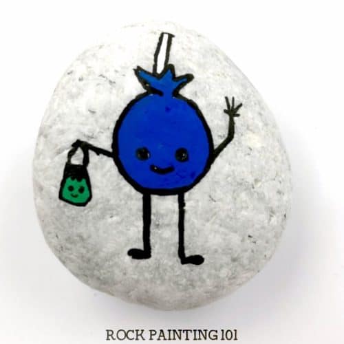 Learn how to paint a lollipop on rocks with this simple tutorial. Grab your paint pens or your favorite paint brush and let's enjoy this fun Halloween rock painting idea. #halloweenrockpainting #rockpaintingideas #lollipop #sucker #trickortreat #halloweenart #cutehalloweenpaintedrocks #stonepainting #halloweenstones #rockpainting101