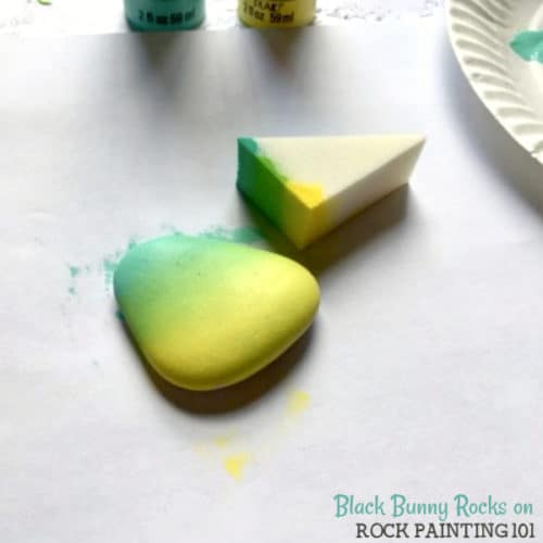 Paint a beautiful gradient background onto your rocks. These are perfect for kindness rocks and sunsets! #gradient #basecoat #rocks #rockpainting #howtopaintrocks #stonepainting #rockpainting101