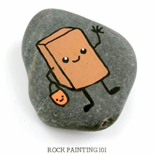 Paint this fun chocolate bar painted rock and you'll have another adorable Halloween trick-or-treater rock. And you'll learn how to draw a fun piece of candy. #chocolatebar #rockpainting #stonepainting #howtodraw #trickortreat #happyhalloween #funrocks #rockpainting101