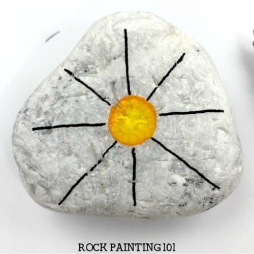 This unique sun zendangle rock painting idea gives a fun twist to the standard vertical dangle technique. Give it a try! #sunrocks #zendangle #dangles #howtopaintrocks #uniquerockpaintingidea #stonepainting #rockart #rockpainting101