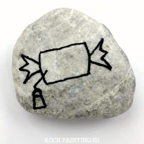 Learn how to draw bubble gum while painting an adorable Halloween rock! This simple rock painting idea is perfect for hiding for the trick or treaters in your neighborhood! #bubblegum #howtodrawgum #gum #rockpaintingidea #halloweenrockpainting #rockpaintingforbeginners #rockpainting101