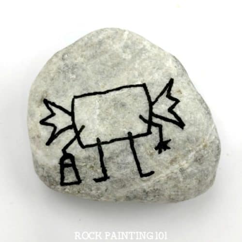 Learn how to draw bubble gum while painting an adorable Halloween rock! This simple rock painting idea is perfect for hiding for the trick or treaters in your neighborhood! #bubblegum #howtodrawgum #gum #rockpaintingidea #halloweenrockpainting #rockpaintingforbeginners #rockpainting101