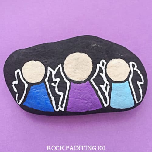 This angel rock painting idea is a super fun way to paint rocks this Christmas. Hide them in your neighborhood, or put them in a stocking. They are sure to brighten someone's day! #angel #christmasangel #howtopaintanangel #angelrocks #rockpaintingideas#christianrocks #rockpainting101