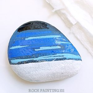 How to make this beautiful winter scene rock painting idea