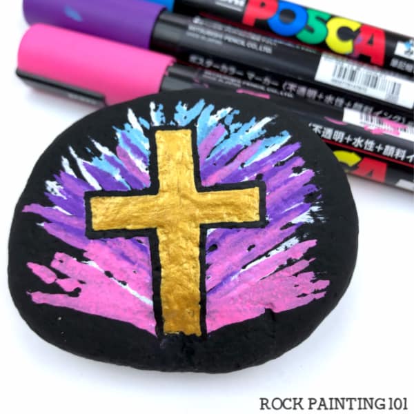 painted rock with golden cross - RockPainting101.com