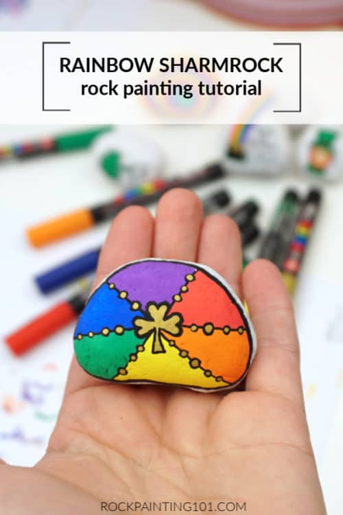 Create this beautiful rainbow shamrock rock. A rock painting tutorial for beginners. St. Patrick's Day rocks.