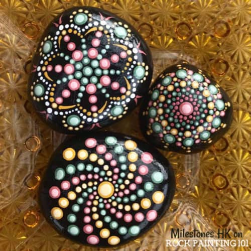 How to create dotted spiral patterns. Rock painting tutorial for beginners.