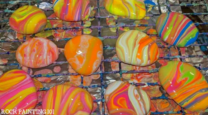 Create beautiful pour painted rocks using these tips for beginners.