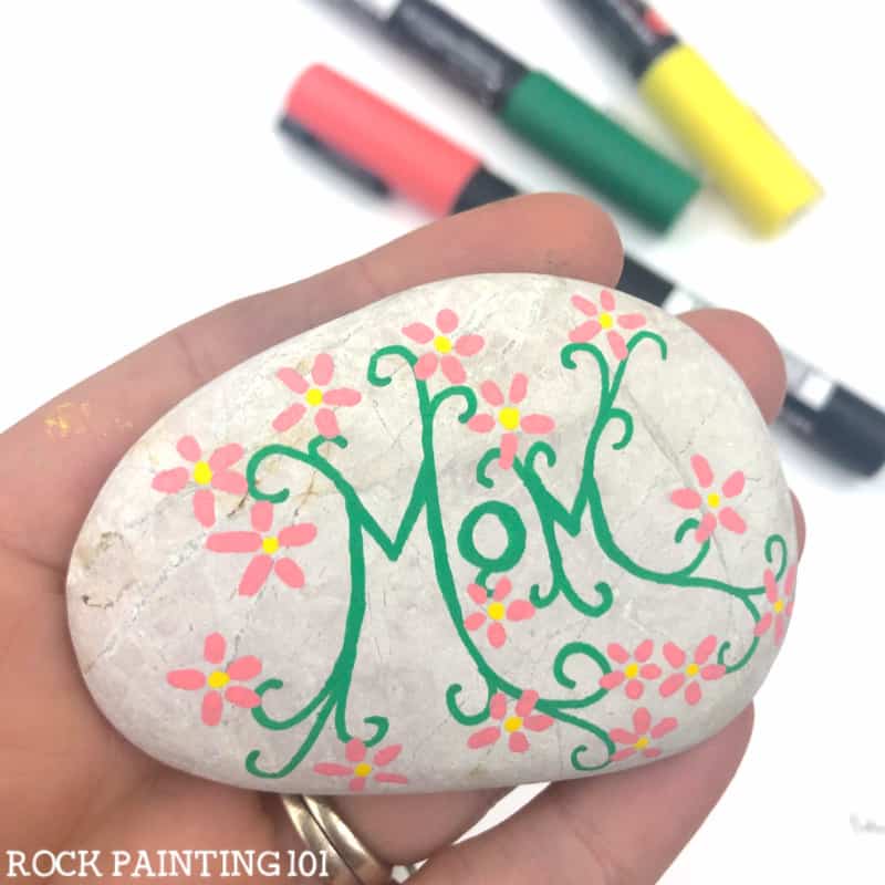 These painted vines with flowers are the perfect start to this mother's day rock design.