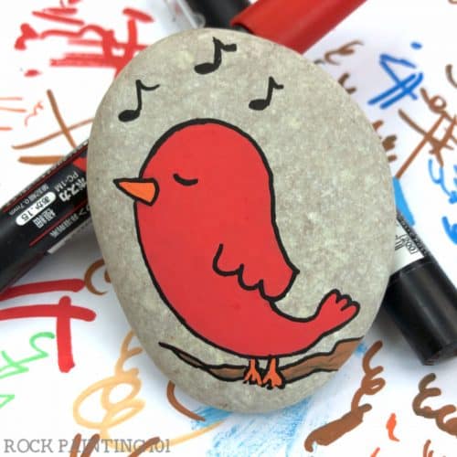Create an adorable singing bird rock to hide around town! Follow along with this rock painting tutorial.