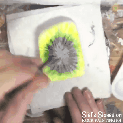 Step by step directions to painting tie dye with alcohol ink on stones.