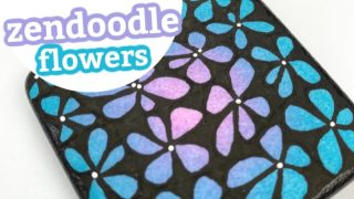 Create beautiful zendoodle style flower painted rocks with this step by step tutorial. Use this rock painting idea to decorate, give as gifts, or hide around your city. #rockpainting101 #zendoodle #flowers #paintedrocks