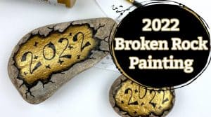 2022 broken new years rock painting design